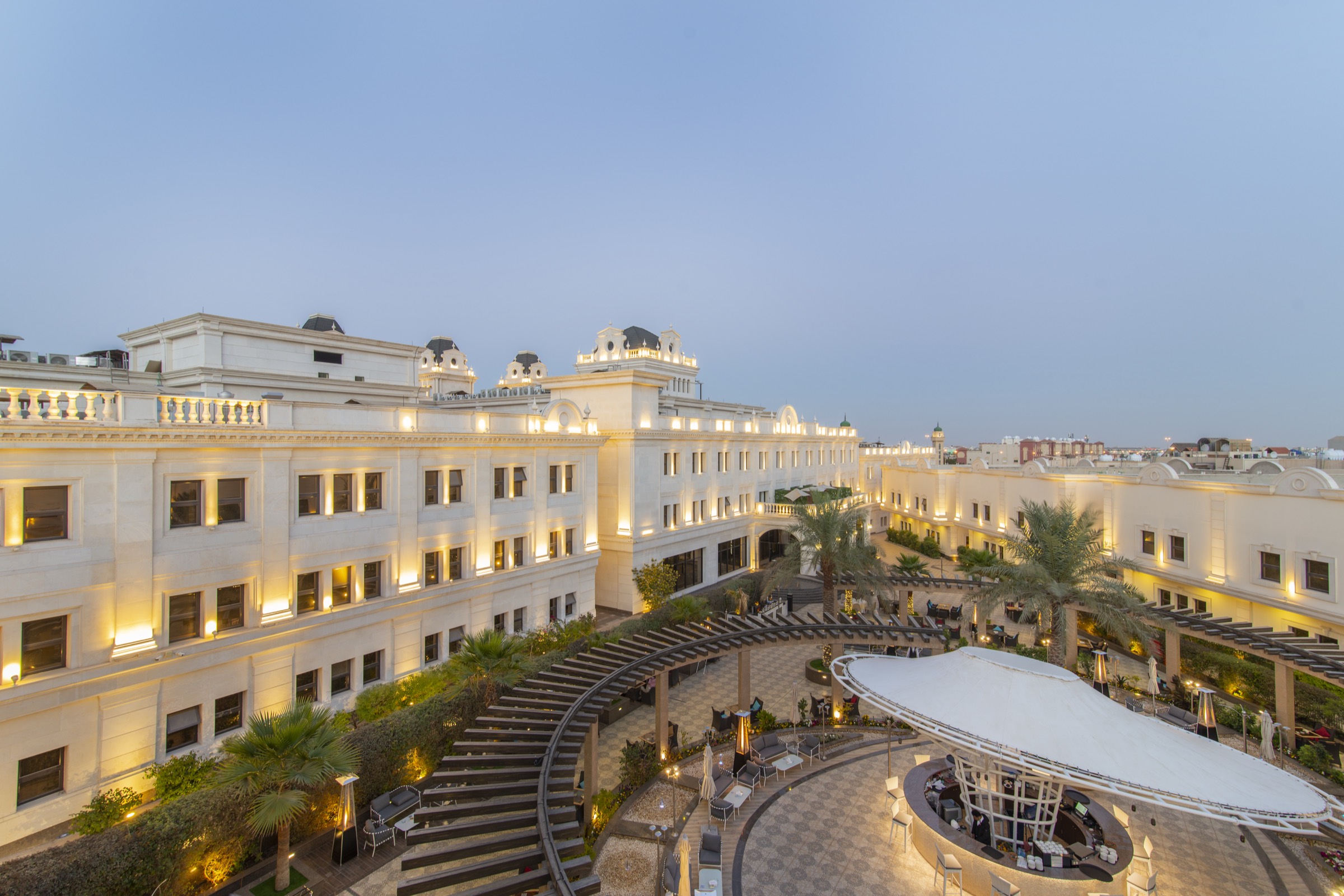 The palace seen from above, its wings enclosing the courtyard gardens