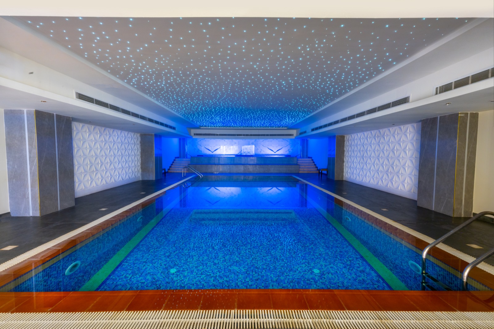 The indoor swimming pool beneath a star-lit ceiling