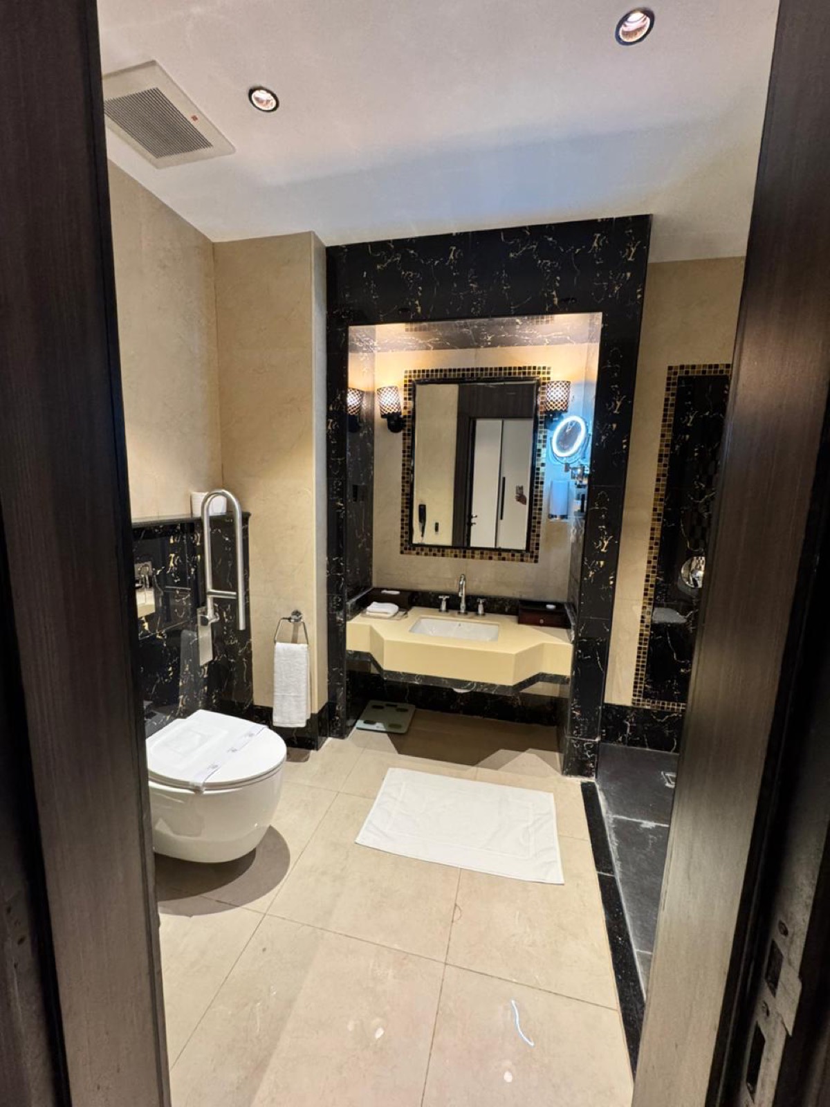 The bathroom's roll-under vanity and its turning space