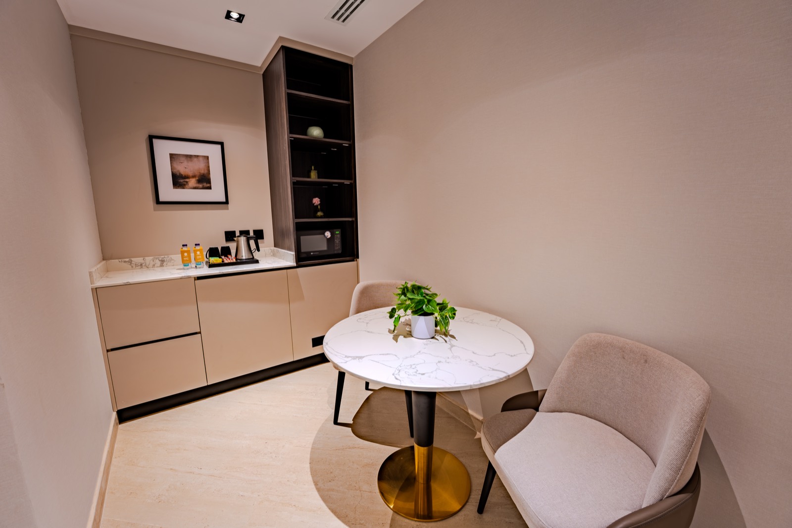 The Deluxe Room's mini-bar and breakfast table